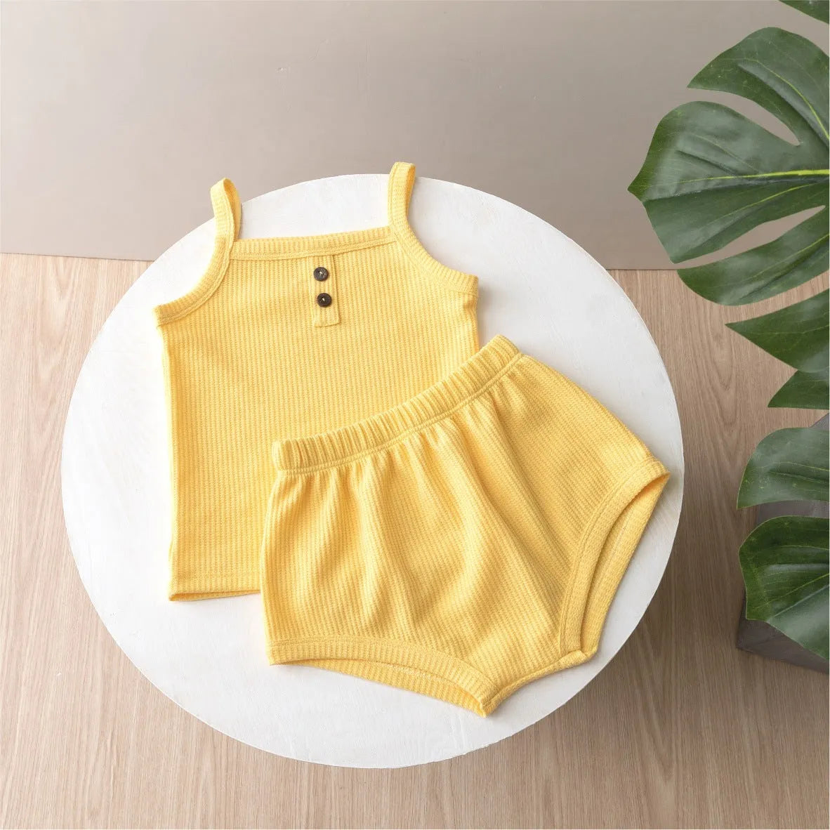 Summer baby camisole set with short sleeves and matching shorts in light yellow cotton fabric