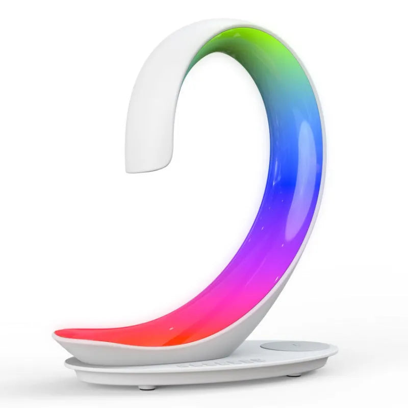 White swan-shaped desktop wireless charger with Bluetooth speaker and colourful ambient lighting