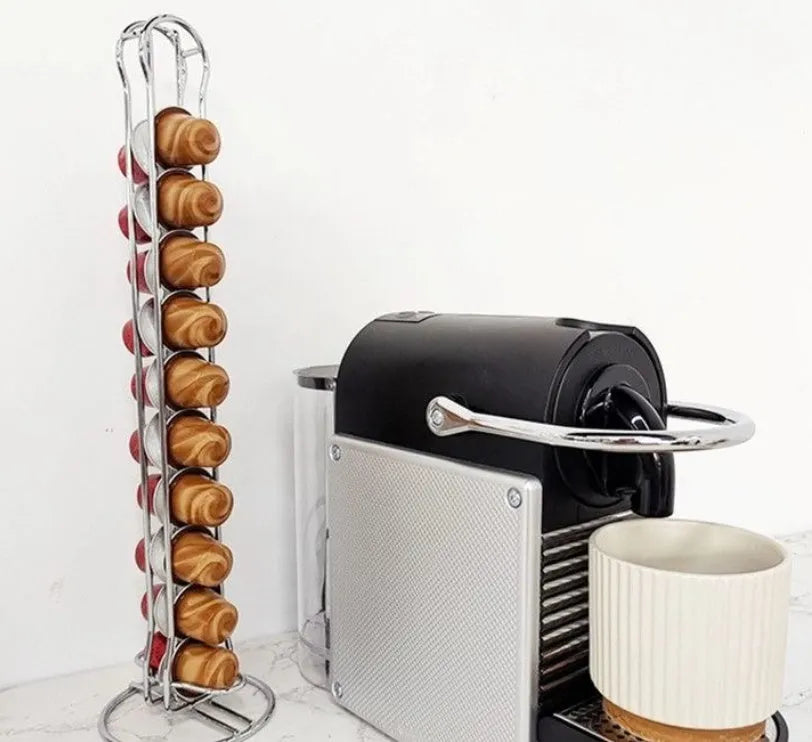 Wrought iron coffee capsule storage rack holding pods, in spray black finish.