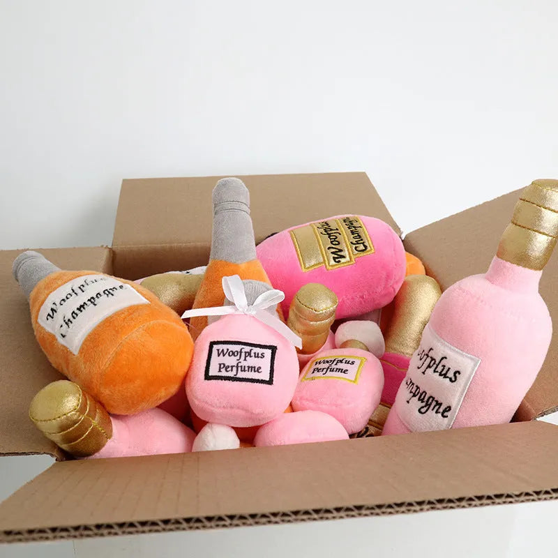 Soft plush pet toy shaped like a wine bottle in assorted colours including green, red, and black.