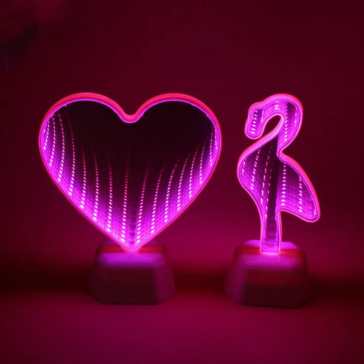 Rose red double-sided love tunnel shape LED decorative light on a flat surface.