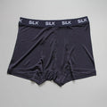 Men's loose-fit silk shorts in navy blue, shown laid flat.