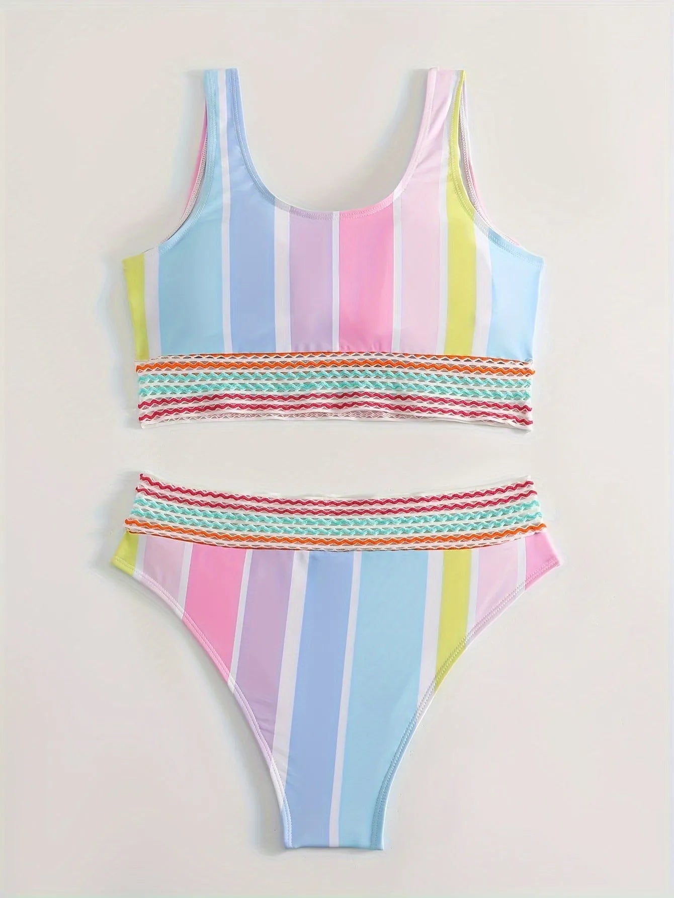 Women's striped sport bikini top and briefs on a white background.