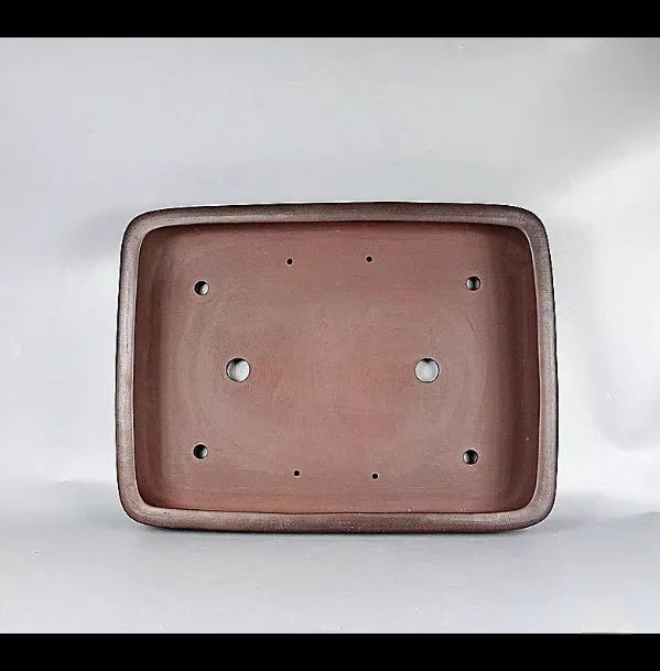 Handmade rectangular antique-style purple clay flower pot showing natural ceramic material