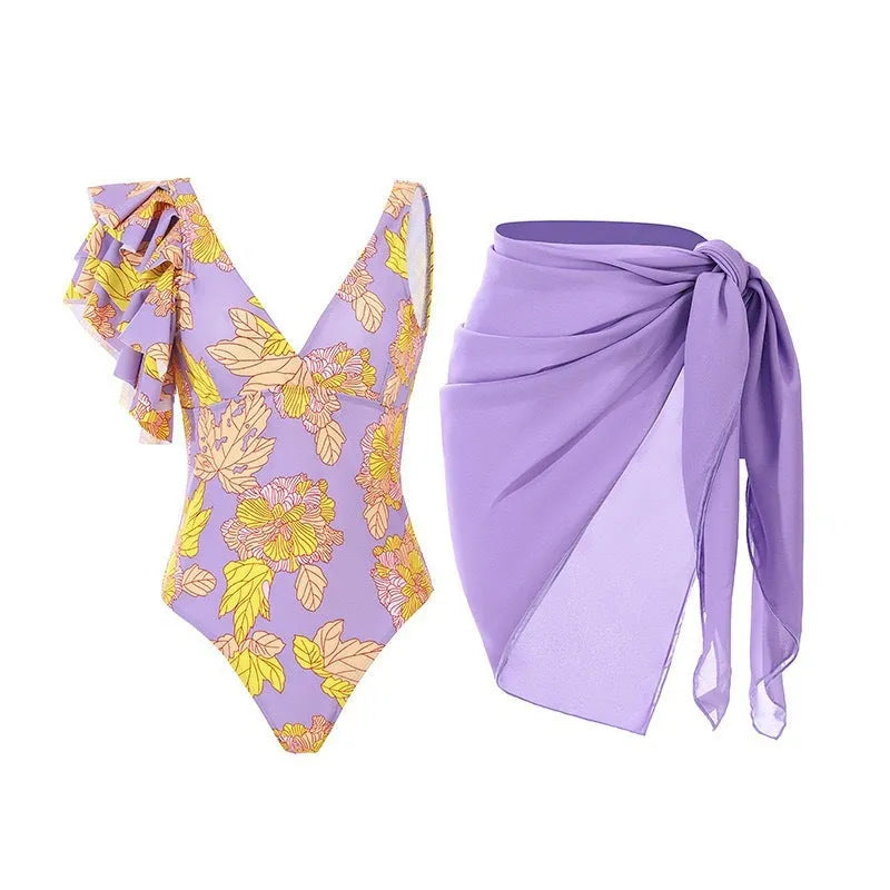 Solid colour women's one-piece swimsuit with spaghetti straps and a matching detachable skirt.