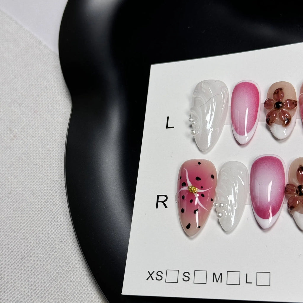 Hand-painted 3D carved nail beauty patches in candy and retro designs on almond-shaped plastic bases.