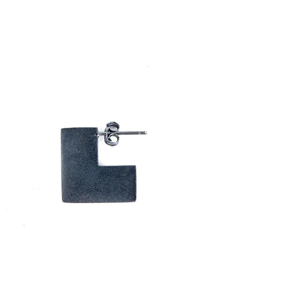 Square oxidised black sterling silver geometric earrings on a white background.