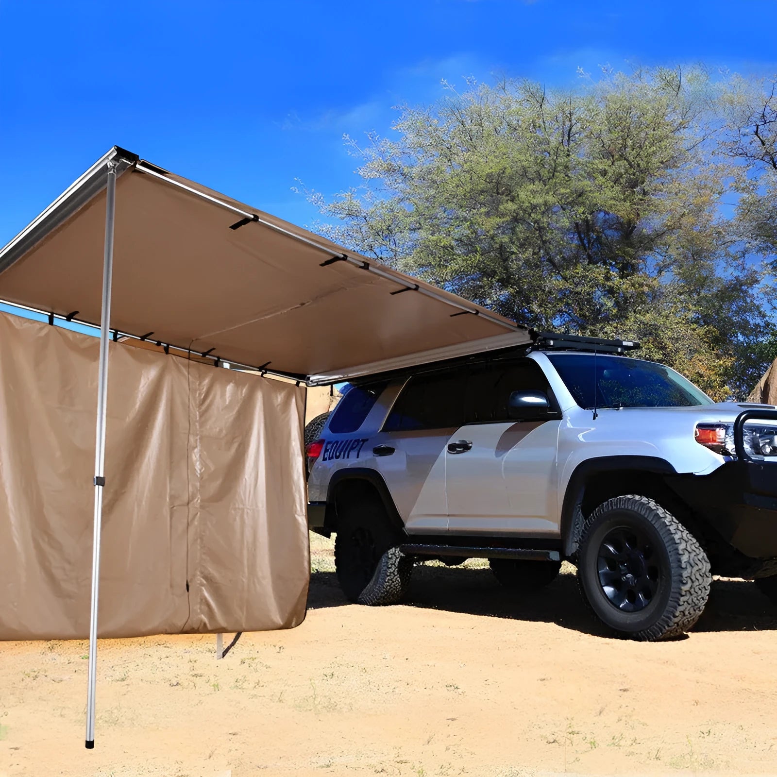 Camouflage two-bedroom camping tent with aluminium poles set up outdoors.