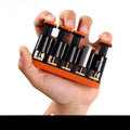 Grey and orange silicone finger strength trainer for musicians and climbers.