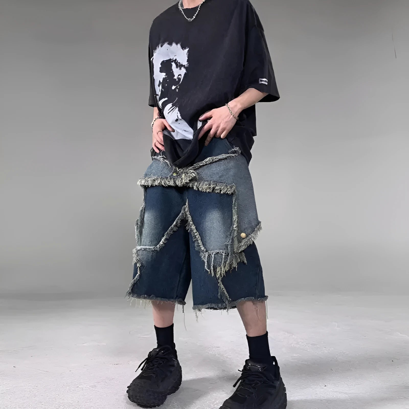 Men's blue denim shorts with frayed five-pointed star detailing and loose fit for summer casual wear