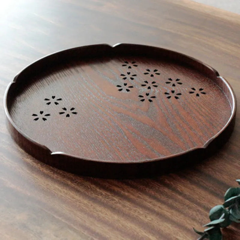 Wooden shallow plate with hollow cherry blossom pattern, 30cm long, for serving desserts indoors.