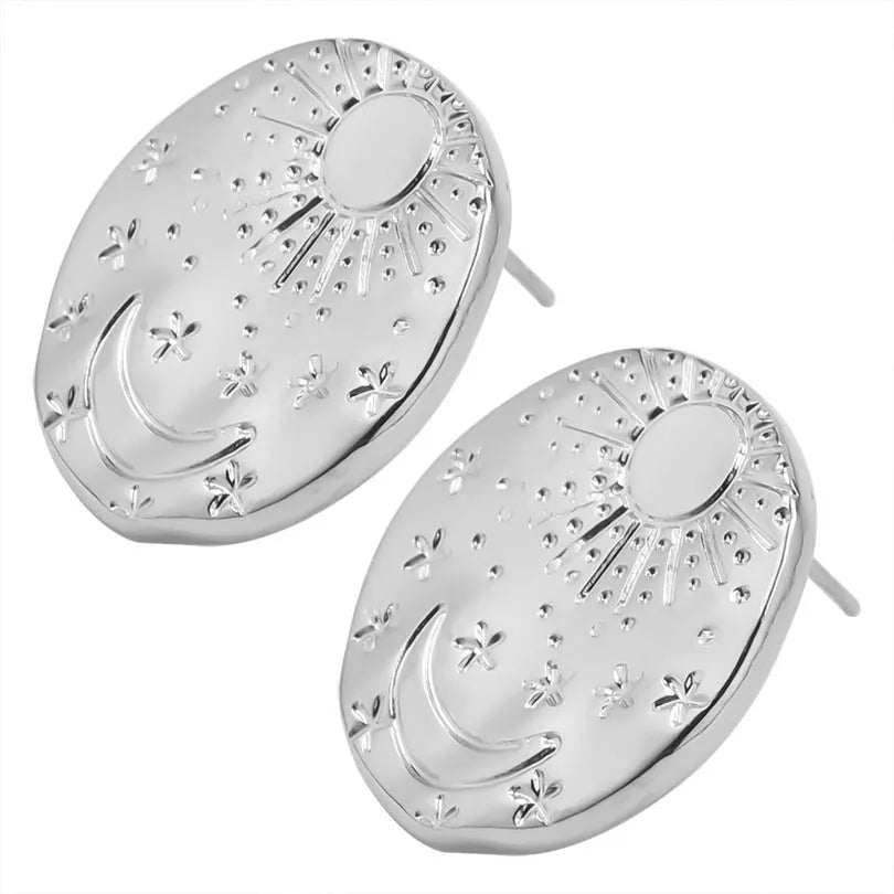 A pair of geometric shell-shaped stud earrings in stainless steel with a gold or silver electroplated finish.