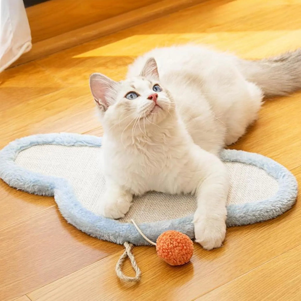 White wall-mounted cat scratching mat with natural sisal and sleeping cat cartoon design.