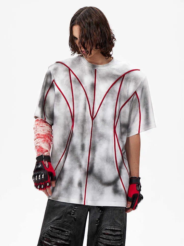 Short sleeve T-shirt with padded shoulders and textured line patchwork design