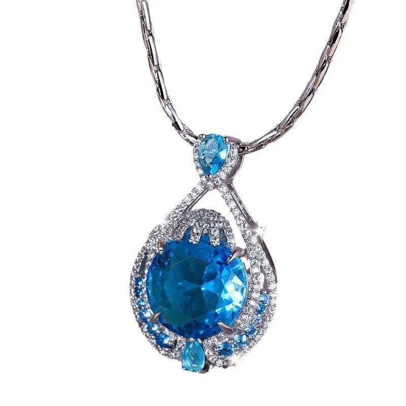 Blue geometric pendant necklace with fireworks cut gems and water wave chain