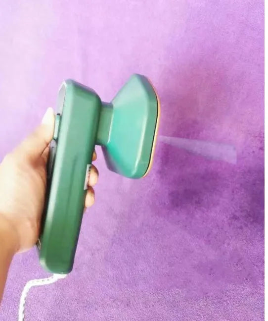Dark green portable hanging steam iron with ceramic panel, compact design for travel garment care
