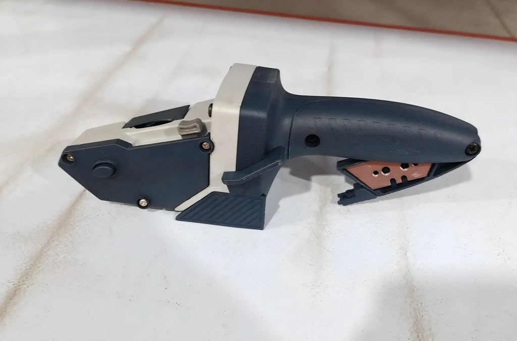 Blue aluminium alloy multifunctional woodworking cutter with scale and one-press lock for cutting boards.