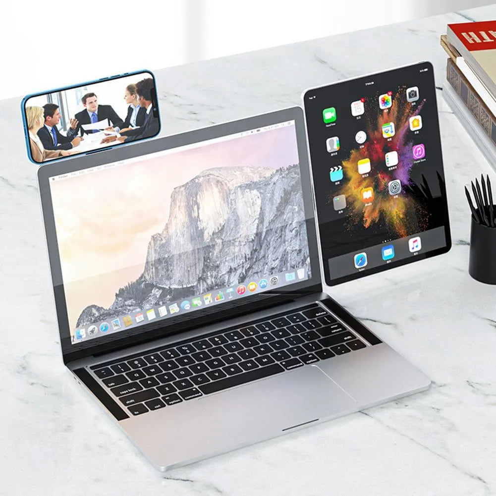 Black aluminium laptop phone holder with magnetic mount attached to computer monitor