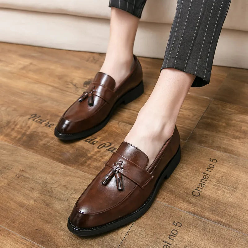 Men's black slip-on business casual leather shoes with tassel detail and rubber sole