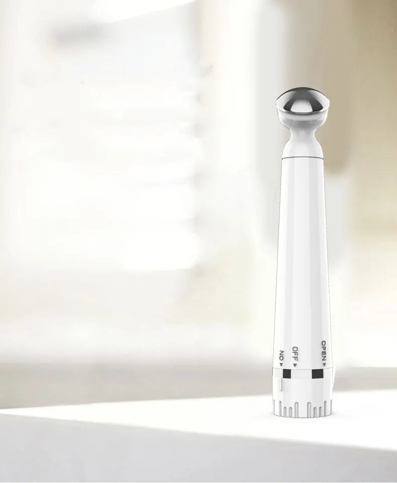 Portable USB rechargeable beauty instrument with white casing and metal light head for neck wrinkle removal