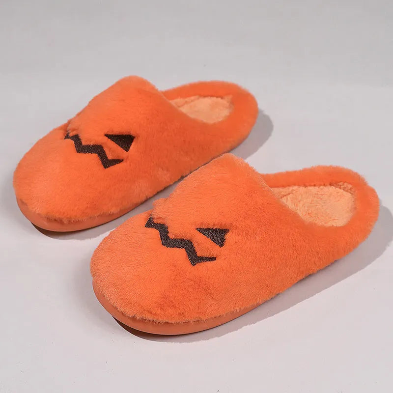 Orange Halloween pumpkin slippers with coral velvet upper and plush lining for indoor winter wear