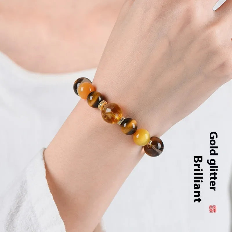 Close-up of a natural yellow artificial crystal string bead bracelet with 10mm tower-shaped beads.