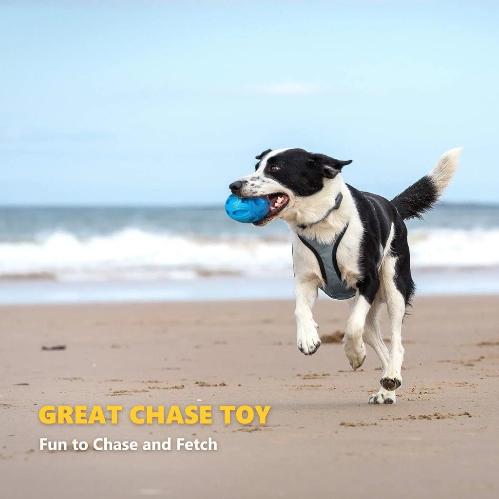 Blue, green, and orange natural rubber squeaky dog ball with textured surface grooves.