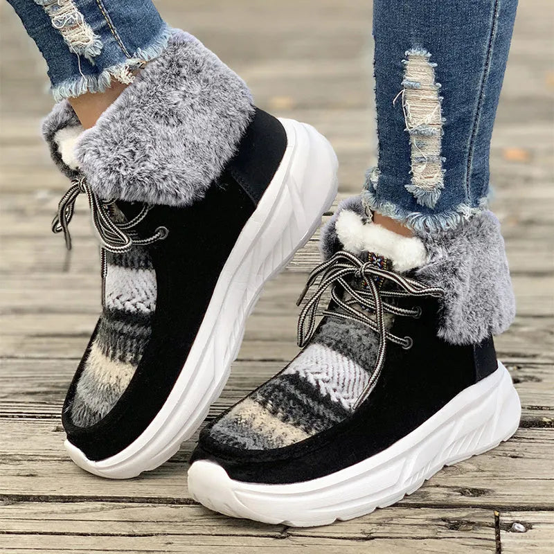 Women's beige lace-up snow boots with suede upper and thick rubber sole on white background