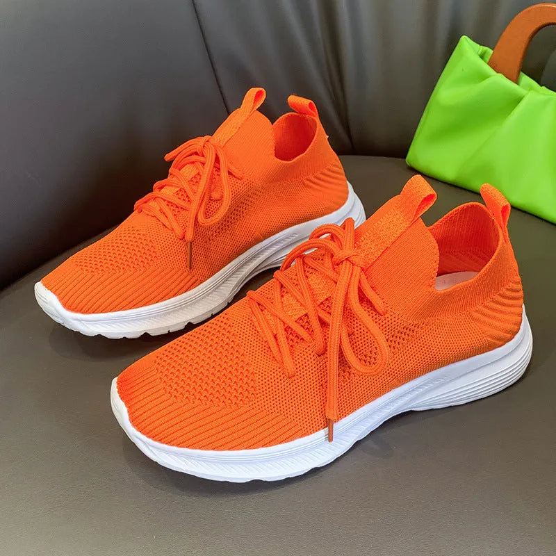 Women's breathable mesh running shoes in three colour options with flyknit upper and rubber sole