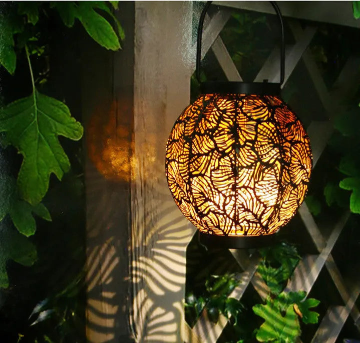 Solar-powered hollow decorative iron courtyard lamp with solar panel