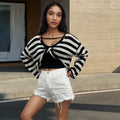 Striped long-sleeve pullover sweater in Mercerised cotton, shown in multiple colours, highlighting front/back wearable design.