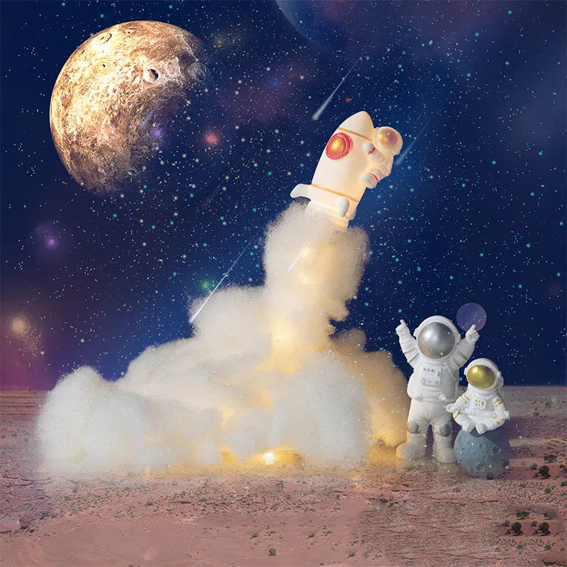 DIY astronaut rocket LED night light kit components including small model, straws, chassis, and string lights for assembly.