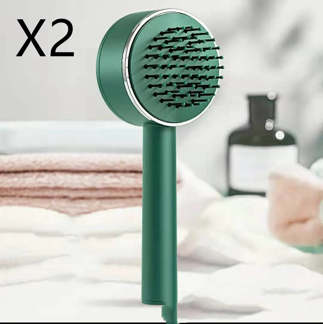 Plastic air cushion comb with long handle in white, green, and pink colours for hair detangling and styling