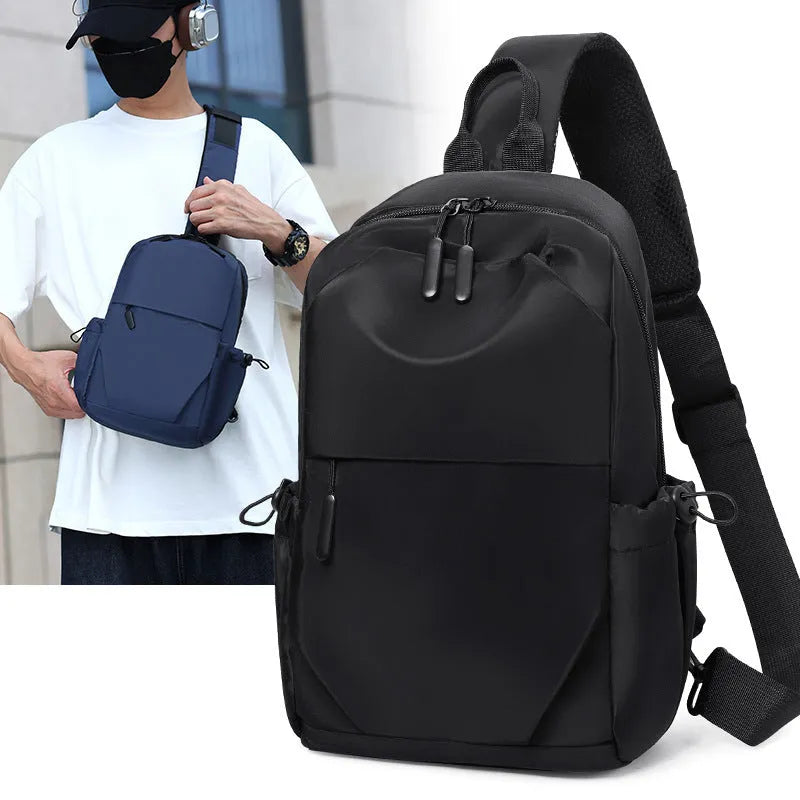 Grey men's waterproof chest bag shown on shoulder, displaying its 33cm height and spacious main compartment.