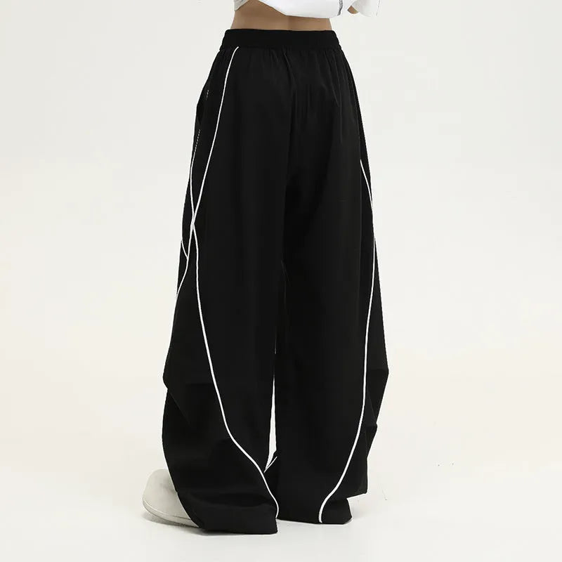Black pleated wide-leg hip hop trousers with stripe pattern and mid waist cut