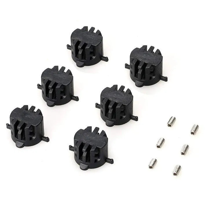 Set of six PVC surfboard G5 tail rudders in round cup design, black colour, on a flat surface