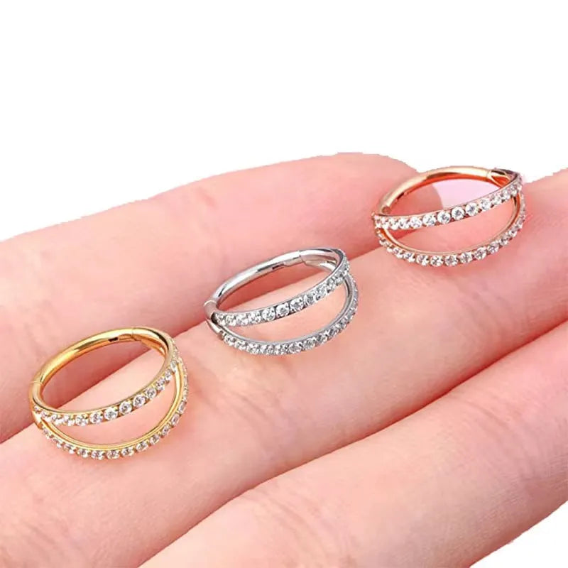 G23 titanium alloy nose ring with zircon stone in gold and steel colours showing 1.2mm gauge stud