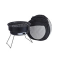 Small round metal folding camping stove with grill mesh and legs, packed in a carry bag.