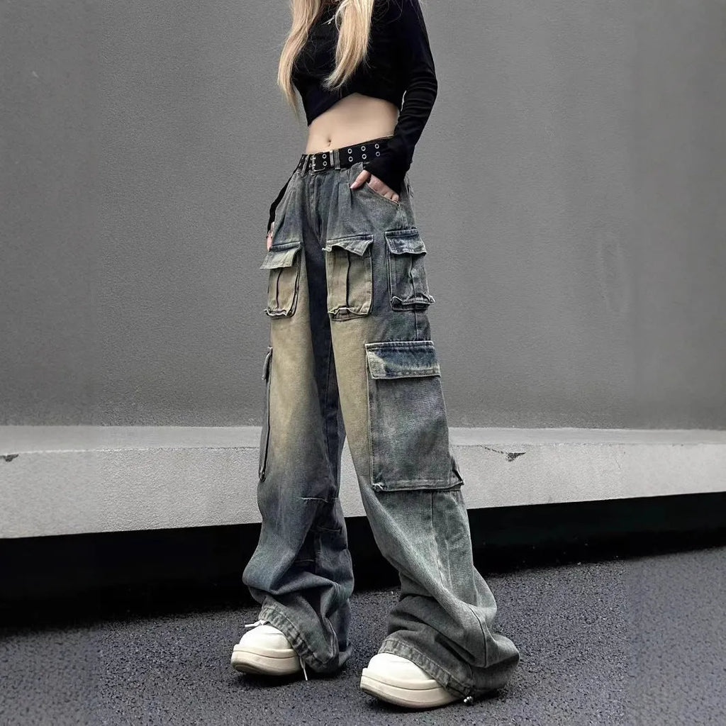 Men's light blue loose fit distressed jeans with multiple pockets on a straight leg.