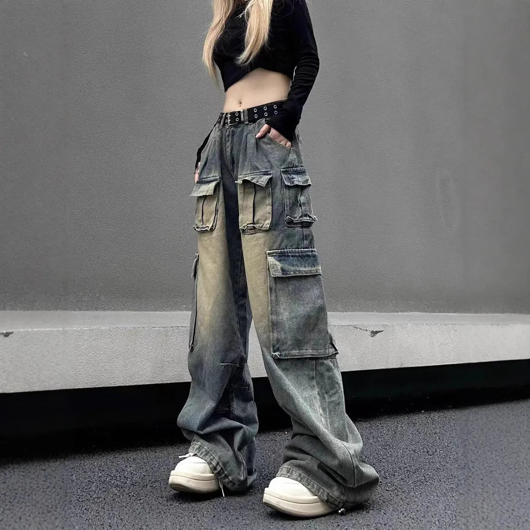 Men's light blue loose fit distressed jeans with multiple pockets on a straight leg.