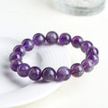 Natural feather amethyst crystal bracelet in snow mountain purple with scattered beads and ruyi geometry.