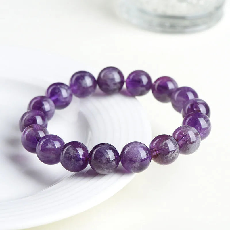 Natural feather amethyst crystal bracelet in snow mountain purple with scattered beads and ruyi geometry.