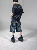 Men's blue denim shorts with frayed five-pointed star detailing and loose fit for summer casual wear