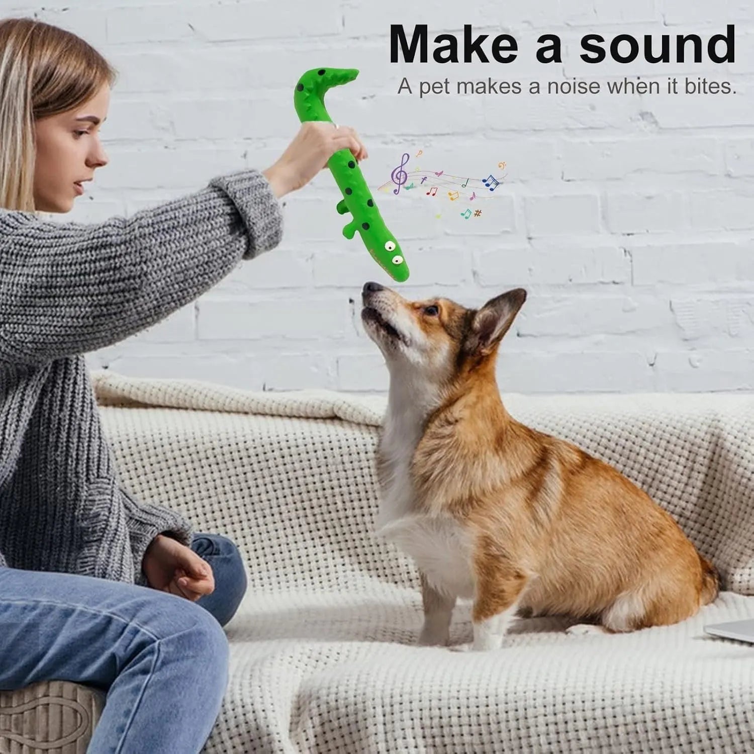 Green cartoon lizard shaped dog chew toy with squeaker on a white background.