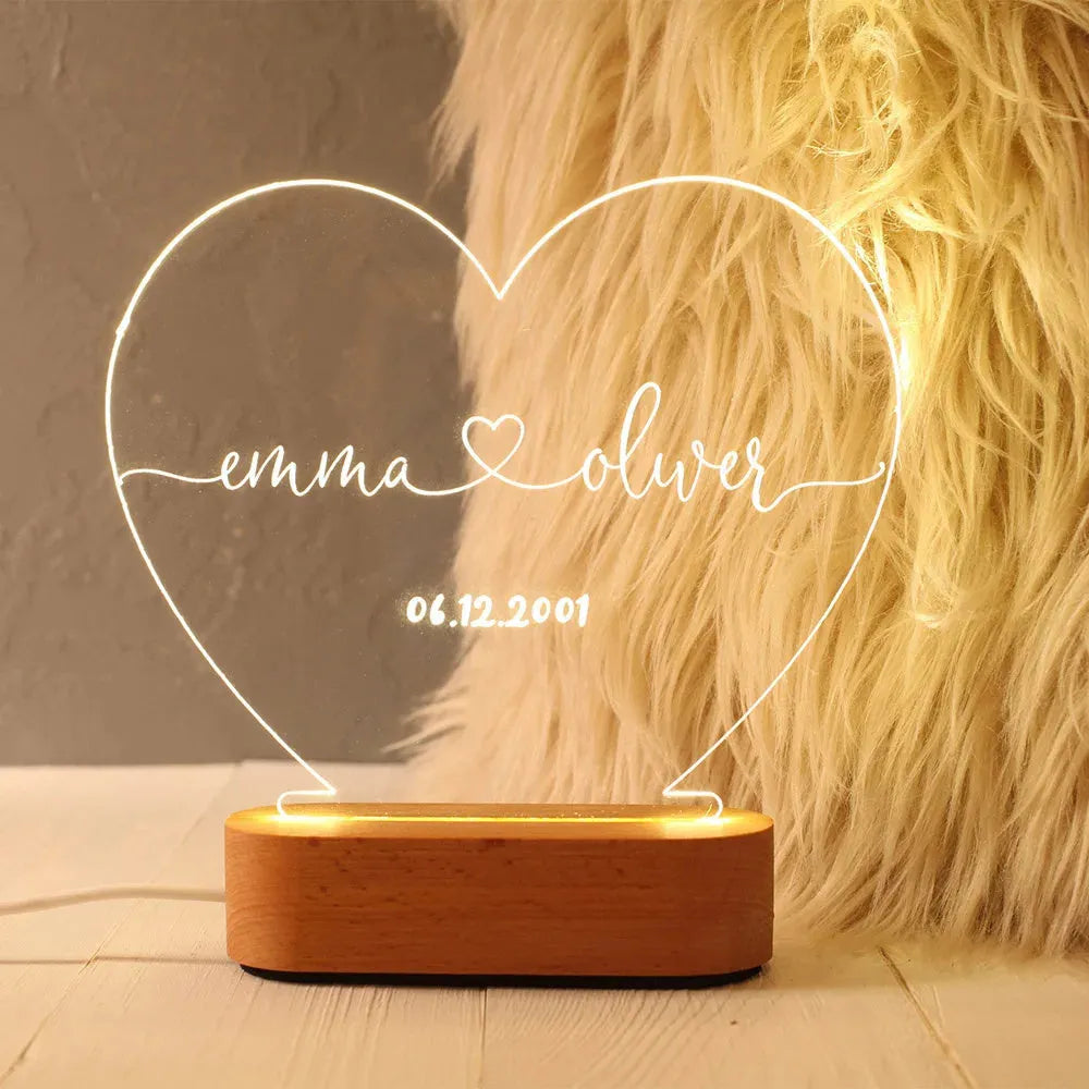 Personalised acrylic LED night light showing custom names and dates with transparent 20x11.5cm design