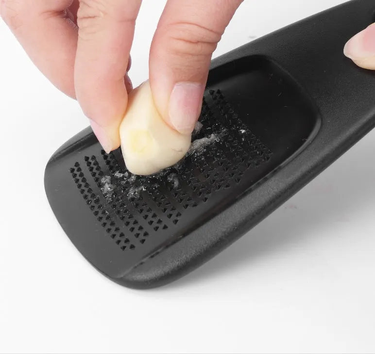 Six stackable kitchen gadget utensils and a cleaning brush in a colour box