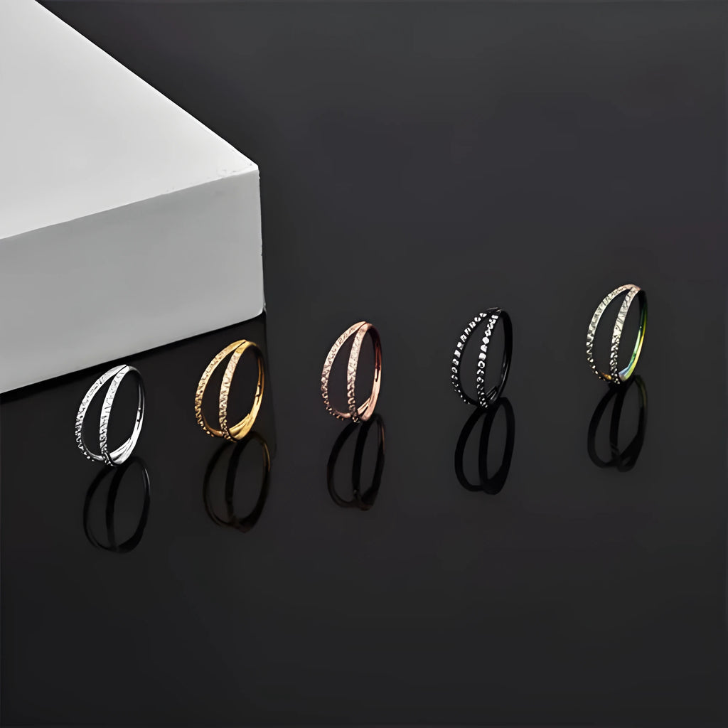 G23 titanium alloy nose ring with zircon stone in gold and steel colours showing 1.2mm gauge stud