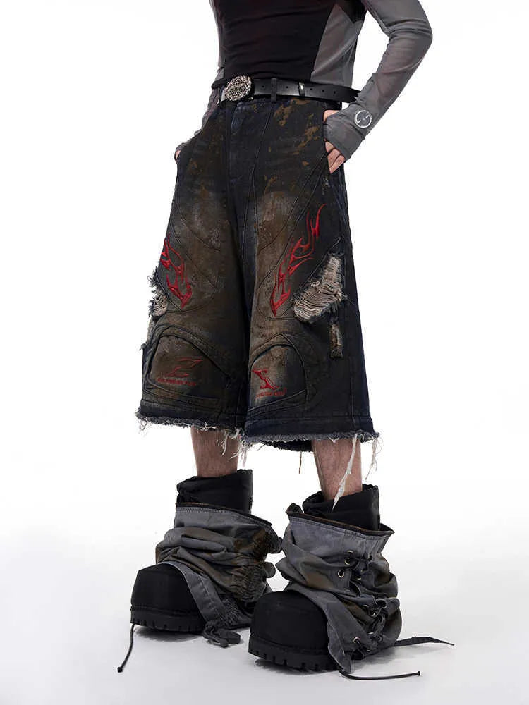 Men's retro style denim jeans with detachable trouser legs in a wide leg, loose fit.