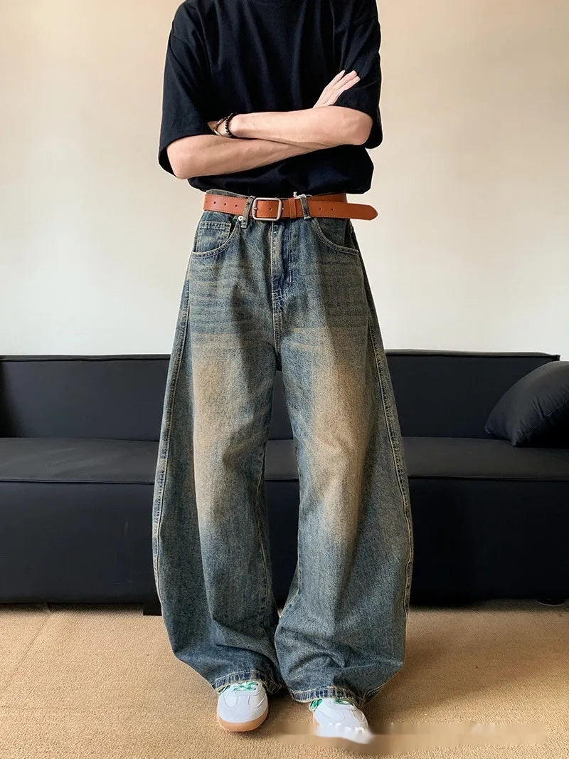 Men's retro blue distressed denim jeans with slim wide-leg fit showing micro elasticity fabric