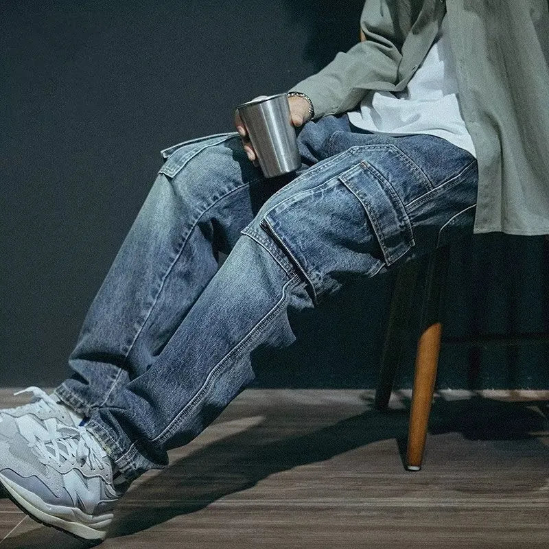 Men's blue loose straight retro style polyester denim trousers on a neutral background.